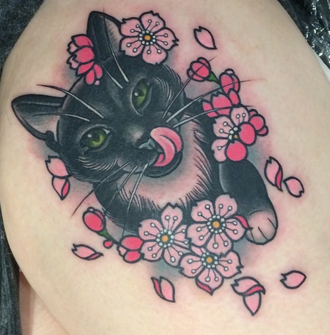 Sweet looking colored thigh tattoo of beautiful cat with flowers