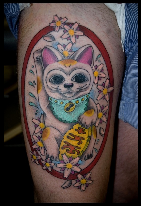 Sweet looking colored thigh tattoo of Asian lucky cat and flower s