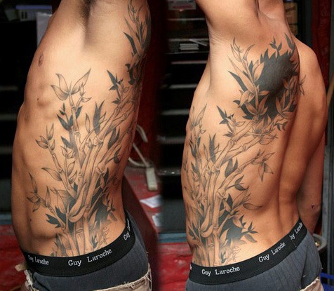 Sweet looking realism style side tattoo of beautiful flowers