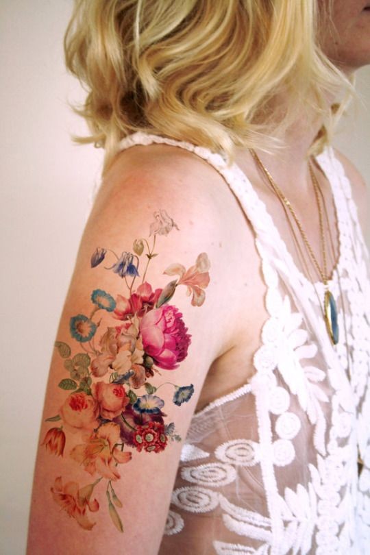 Sweet painted and colored various flowers tattoo on shoulder