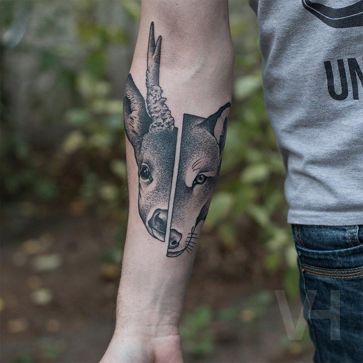 Symmetrical awesome looking forearm tattoo of animals skulls by Valentin Hirsch
