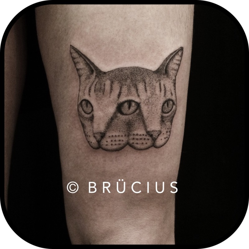 Symmetrical dot style thigh tattoo of cat