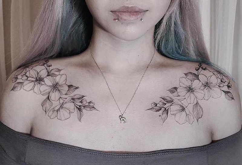 Symmetrical painted by Zihwa tattoo of beautiful flowers