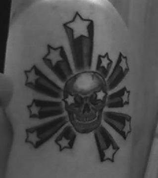 Black and white skull with stars tattoo