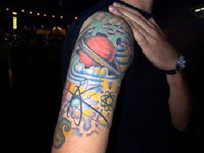 Outerspace in colour tattoo on shoulder
