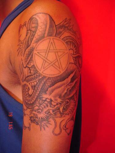 Asian dragon and pentagram tattoo