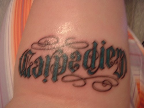 Carpe diem ambigram tattoo in latin