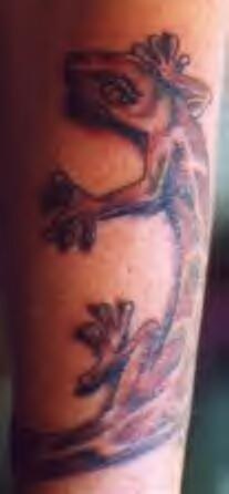 Crawling lizard realistic tattoo