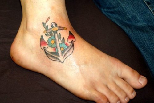 Coloured anchor with flowers tattoo on ankle