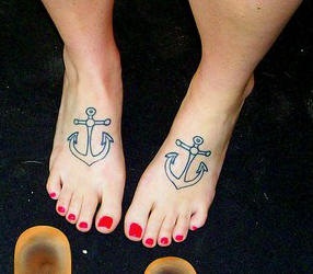Two anchor tattoos on both outer feet