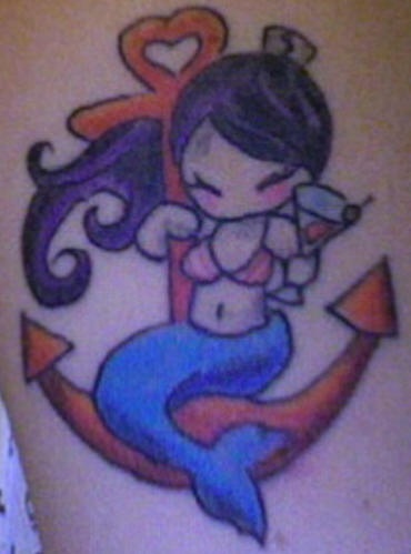 Cartoonish mermaid on anchor tattoo