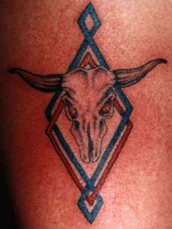 Skull with horns coloured tattoo