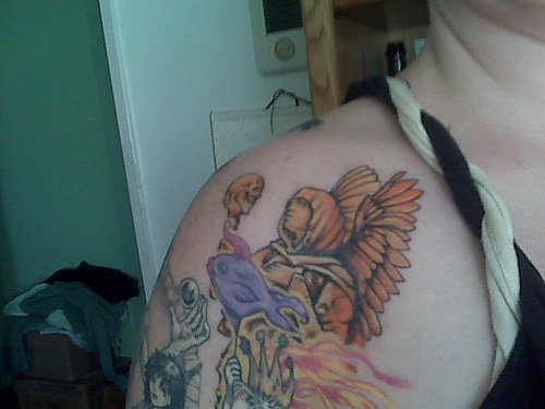 Colourful angel tattoo on shoulder