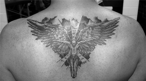 Rising angel tattoo on back