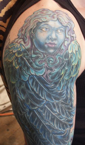 Blue girl hugged by angel wings