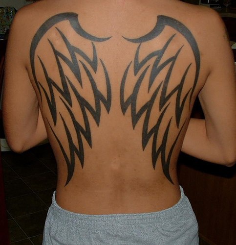 Large black angel wings tattoo on back
