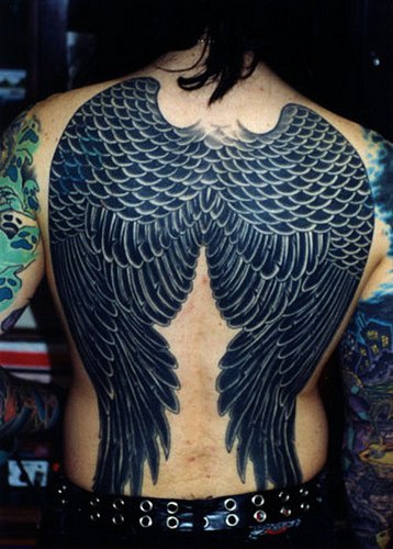 Large qualitative angel wings tattoo on back