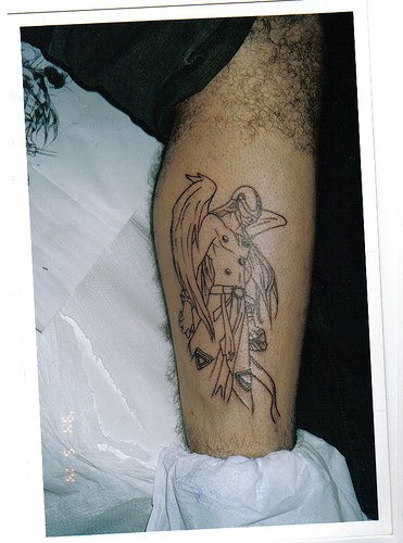 Angemon from digimon world tattoo on leg