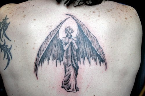 Female angel with large wings tattoo on back