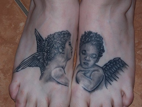 Two cherubs tattoo on both feet