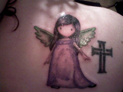 Black cross and cute little angel tattoo