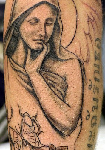Angelic girl in cape tattoo