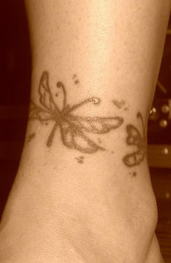 Cains of butterflies ankle tattoo