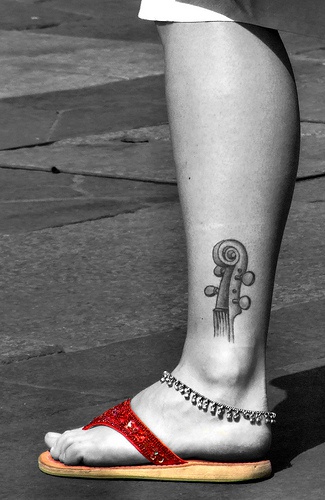 Guitar ankle tattoo