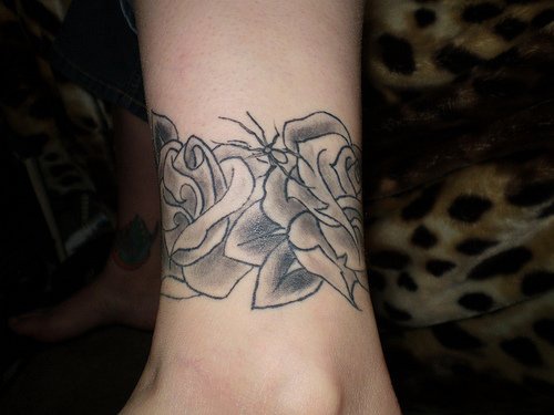 Black wide roses ankle tattoo