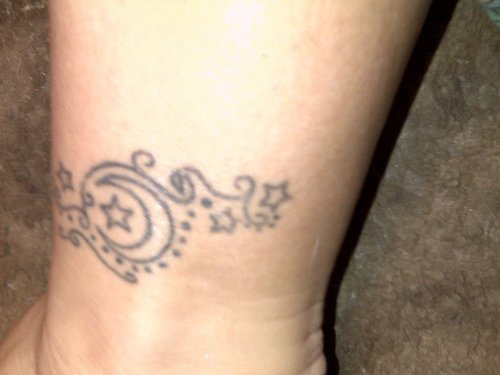 Night sky pattern ankle tattoo