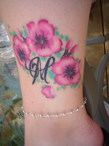 Pink beautiful flowers ankle tattoo