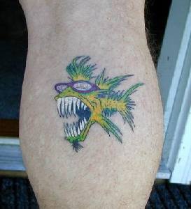 Toothy yellow fish in glasses tattoo
