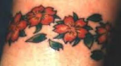 Coloured flowers armband tattoo