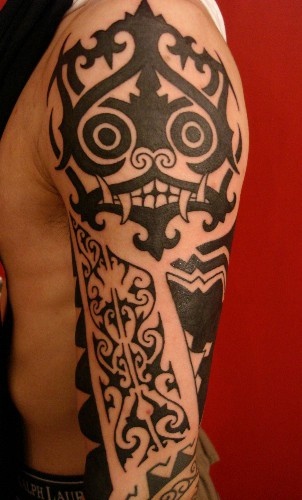 Designed skull full arm tattoo