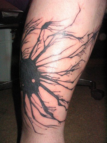 Horror spider arm tattoo