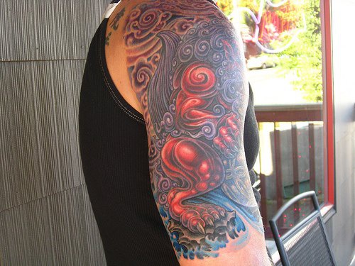Tattoo von schön gestaltetem Tier  am Arm