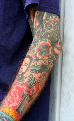 Hungry man arm tattoo