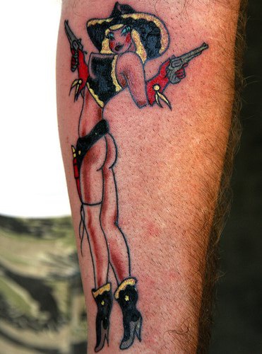Cow-girl arm tattoo