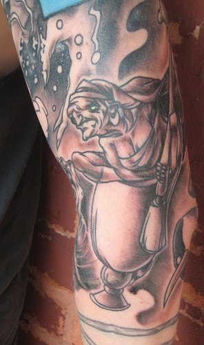 Monster arm tattoo