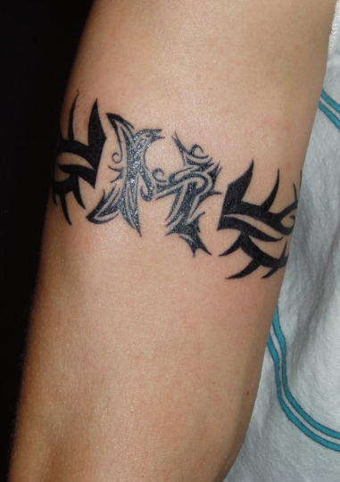 Tribal tattoo with xl marking