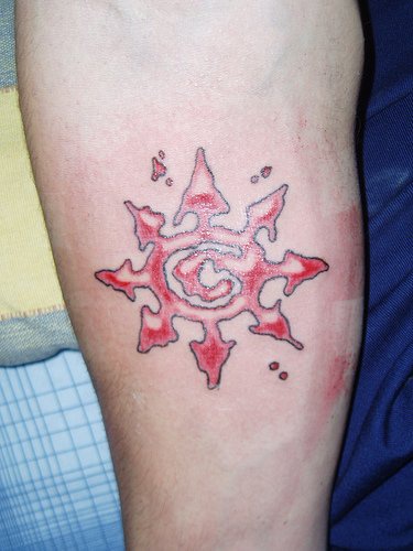 Designed star arm tattoo