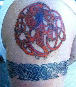 Red dragon in mystic cell tattoo
