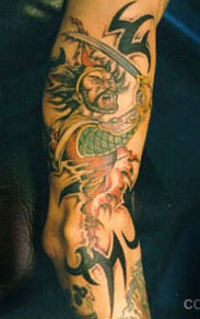 Samurai in rage coloured tattoo on arm