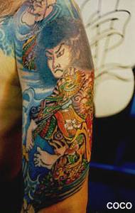Kabuki artist colourful tattoo on arm