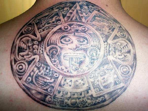 Aztec calendar stone tattoo on upper back