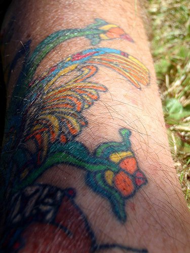 Coloured aztec style tattoo