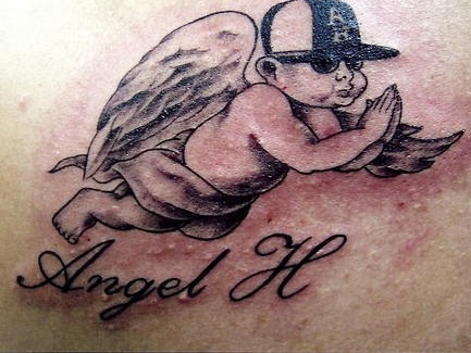 Gangsta cherub in hat tattoo
