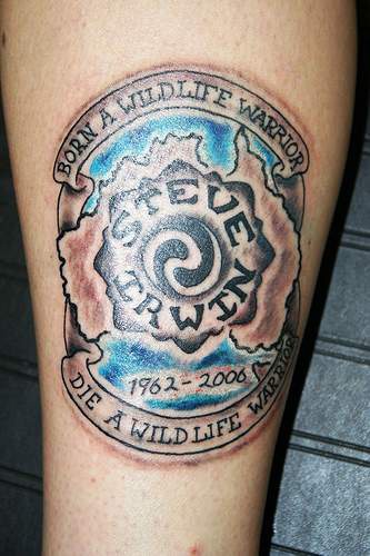 Symbol with motto memorial tattoo