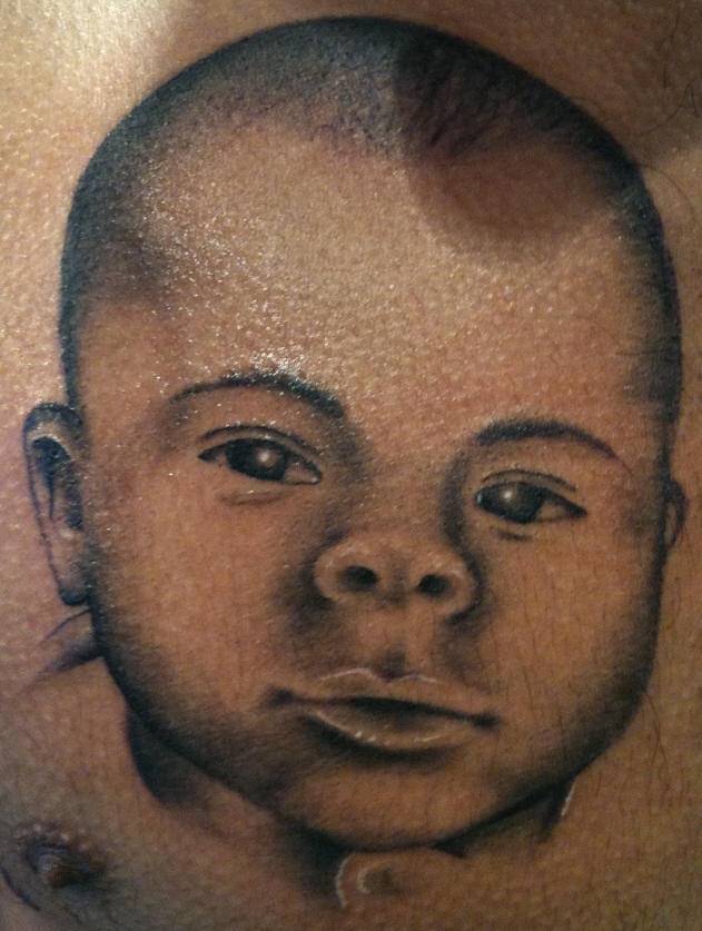 Little baby portrait tattoo