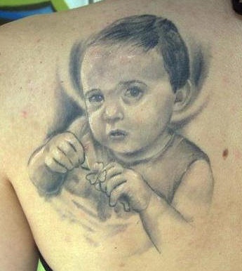 Small child with clover tattoo